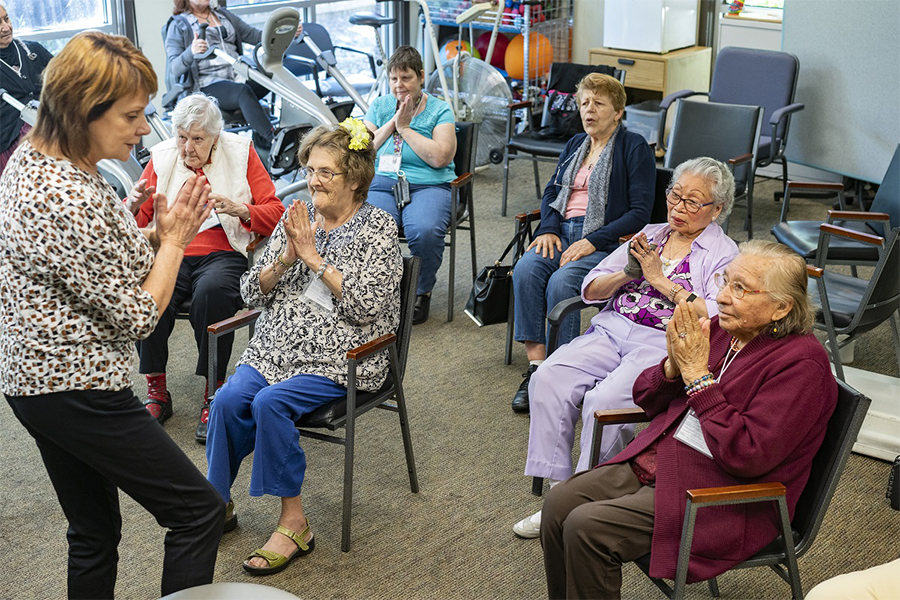 Seniors enjoying a group activity in a sunlit common room